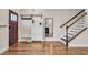 Entryway with hardwood floors, coat rack, and white storage cabinet at 532 Lena Cir, Chapel Hill, NC 27516