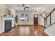 Living room with hardwood floors, fireplace, and access to stairs at 532 Lena Cir, Chapel Hill, NC 27516
