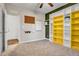 Well-lit bedroom with built-in shelving and access to hallway at 532 Lena Cir, Chapel Hill, NC 27516