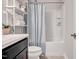 Clean bathroom with a shower/tub combo, white toilet and dark vanity at 532 Lena Cir, Chapel Hill, NC 27516