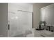 Modern bathroom with a walk-in shower and stylish vanity at 2209 Paddstowe Main Way, Wake Forest, NC 27587
