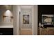 Light-filled hallway with modern artwork and neutral tones at 2209 Paddstowe Main Way, Wake Forest, NC 27587
