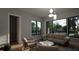Cozy living room features large windows and comfortable seating at 2209 Paddstowe Main Way, Wake Forest, NC 27587