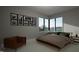 Bedroom with mid-century modern furniture and large windows at 2209 Paddstowe Main Way, Wake Forest, NC 27587
