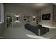 Home theater with sectional sofa and large screen at 2209 Paddstowe Main Way, Wake Forest, NC 27587