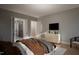 Spacious bedroom with ensuite bathroom access and a dresser at 2209 Paddstowe Main Way, Wake Forest, NC 27587