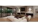 Modern Gathering room with fireplace, built-ins and sliding doors to patio at 2209 Paddstowe Main Way, Wake Forest, NC 27587