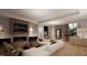 Open floor plan with modern fireplace and large sectional sofa at 2209 Paddstowe Main Way, Wake Forest, NC 27587