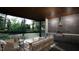 Outdoor kitchen and lounge area with seating and a grill at 2209 Paddstowe Main Way, Wake Forest, NC 27587
