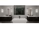Elegant bathroom with freestanding tub and double vanities at 2209 Paddstowe Main Way, Wake Forest, NC 27587