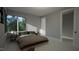 Cozy bedroom with wood flooring and access to a closet at 2209 Paddstowe Main Way, Wake Forest, NC 27587