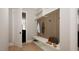 Convenient mudroom with built-in bench, shelving, and coat hooks at 2209 Paddstowe Main Way, Wake Forest, NC 27587