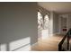 Bright hallway with wood floors and framed artwork at 2209 Paddstowe Main Way, Wake Forest, NC 27587