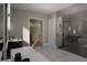 Spa-like bathroom with a large shower, double vanity and walk-in closet at 2209 Paddstowe Main Way, Wake Forest, NC 27587