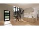Modern entryway with floating staircase and built-in shelving at 2209 Paddstowe Main Way, Wake Forest, NC 27587