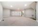 Large bonus room featuring carpet, multiple closets, and access to the outdoors at 6300 Swallow Cove Ln, Raleigh, NC 27614