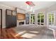 Gathering room featuring a fireplace, built-in shelving, and large windows at 6300 Swallow Cove Ln, Raleigh, NC 27614