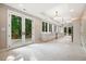 Modern kitchen with white cabinets, long island, and access to backyard at 6300 Swallow Cove Ln, Raleigh, NC 27614