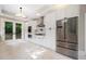 Modern kitchen with white cabinets, stainless steel appliances, and French doors at 6300 Swallow Cove Ln, Raleigh, NC 27614