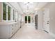Modern kitchen features white cabinets, quartz countertops, and stainless steel appliances at 6300 Swallow Cove Ln, Raleigh, NC 27614