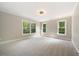 Bright bedroom with carpet flooring and large windows at 6300 Swallow Cove Ln, Raleigh, NC 27614