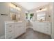 Bathroom boasts double vanities, modern fixtures, and ample storage at 6300 Swallow Cove Ln, Raleigh, NC 27614