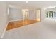 Spacious hallway with hardwood and carpeted floors, leading to bedrooms at 6300 Swallow Cove Ln, Raleigh, NC 27614