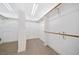 Spacious walk-in closet with built-in shelving and hanging rods at 6300 Swallow Cove Ln, Raleigh, NC 27614
