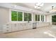 Large kitchen with white cabinets, stainless steel appliances, and ample counter space at 6300 Swallow Cove Ln, Raleigh, NC 27614