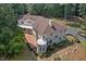 An aerial view showcasing the house and backyard deck at 6300 Swallow Cove Ln, Raleigh, NC 27614