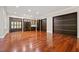 Spacious game room with hardwood floors and ample storage at 6300 Swallow Cove Ln, Raleigh, NC 27614