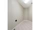 Basement laundry room with tile flooring and built-in shelving at 6300 Swallow Cove Ln, Raleigh, NC 27614