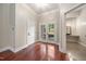 Bright entryway with hardwood floors and French doors leading to backyard at 6300 Swallow Cove Ln, Raleigh, NC 27614