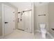 Bathroom with a large glass shower and modern fixtures at 6300 Swallow Cove Ln, Raleigh, NC 27614
