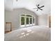 Large bedroom with access to a private balcony and a ceiling fan at 6300 Swallow Cove Ln, Raleigh, NC 27614