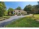 Two-story house with a balcony, driveway, and landscaping at 6300 Swallow Cove Ln, Raleigh, NC 27614