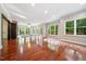 Sunlit great room showcasing hardwood floors and abundant natural light at 6300 Swallow Cove Ln, Raleigh, NC 27614