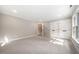 Spacious bedroom with carpet flooring and access to a bathroom at 6300 Swallow Cove Ln, Raleigh, NC 27614