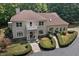 Two story house with balcony, stone accents, and lush landscaping at 6300 Swallow Cove Ln, Raleigh, NC 27614