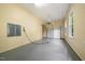 Attached garage with epoxy flooring, one garage door, and ample storage at 6300 Swallow Cove Ln, Raleigh, NC 27614