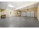 Large garage with epoxy flooring, two garage doors, and extra storage at 6300 Swallow Cove Ln, Raleigh, NC 27614