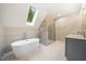 Modern bathroom with a freestanding soaking tub and walk-in shower at 6300 Swallow Cove Ln, Raleigh, NC 27614