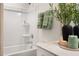 Modern bathroom with a shower/tub combo, updated fixtures, and neutral colors at 219 Anise Ln, Garner, NC 27529
