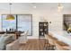 Bright dining area with a wooden table, chairs, and large artwork at 219 Anise Ln, Garner, NC 27529