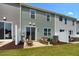 Townhouse exterior with private patio and well-maintained landscaping at 219 Anise Ln, Garner, NC 27529