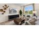 Cozy living room with a large TV, comfy seating, and natural light at 219 Anise Ln, Garner, NC 27529