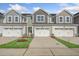 Three-unit townhome building with attached garages and landscaping at 219 Anise Ln, Garner, NC 27529