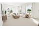Light and airy living room with a neutral color palette and large windows at 2408 Adrift Road, Fuquay Varina, NC 27526