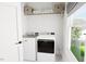Convenient laundry room with washer, dryer, and storage at 2408 Adrift Road, Fuquay Varina, NC 27526