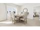 Elegant dining room with a wooden table and six beige chairs at 2408 Adrift Road, Fuquay Varina, NC 27526